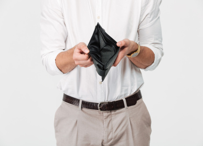 Close up portrait of a man showing empty wallet