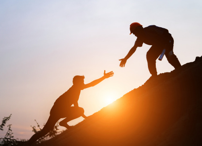 Tourists go up the hill in the sunrise.